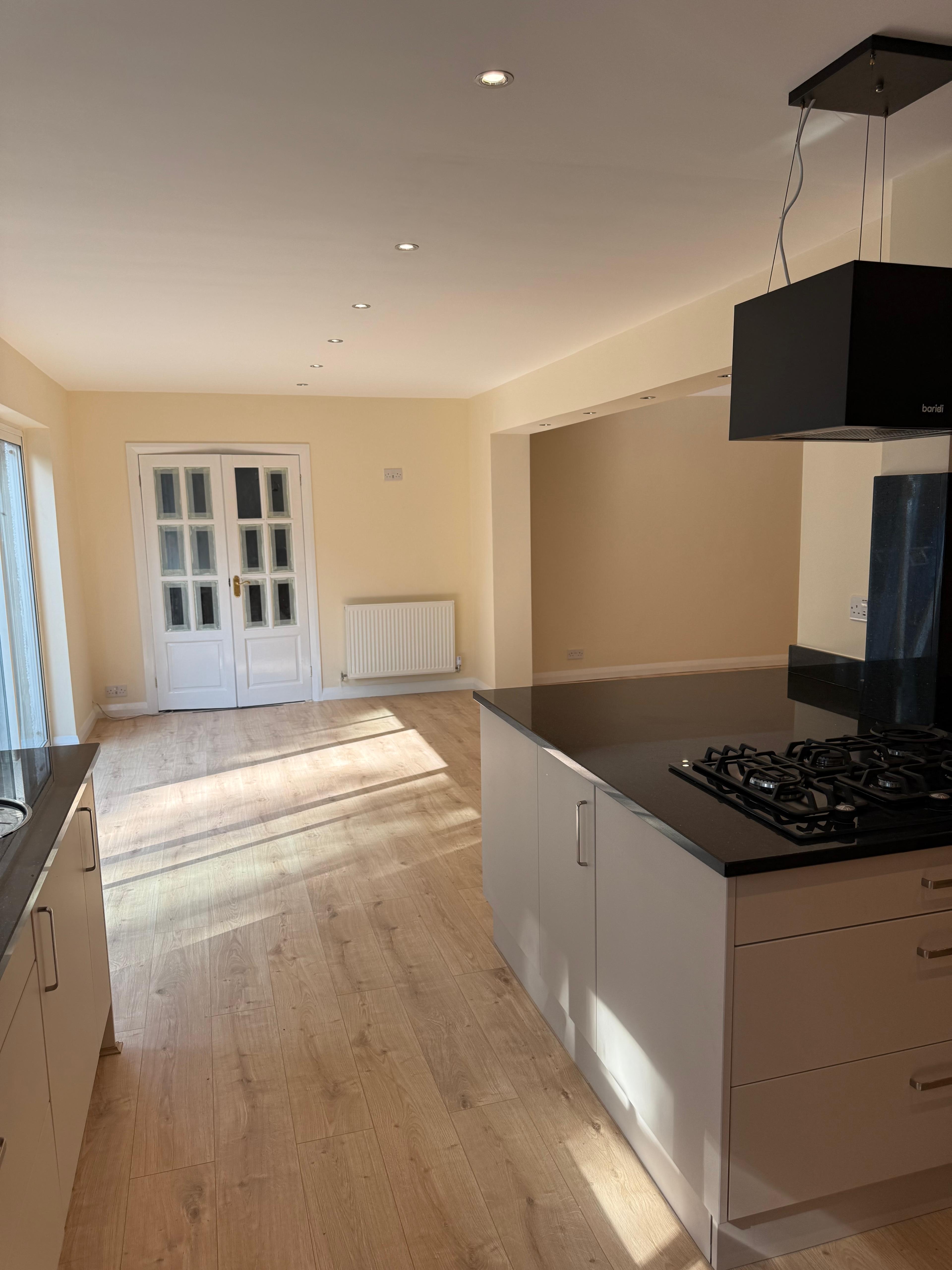 Completed contemporary kitchen after renovation — an example of fit-out quality once the planning route and structure are right